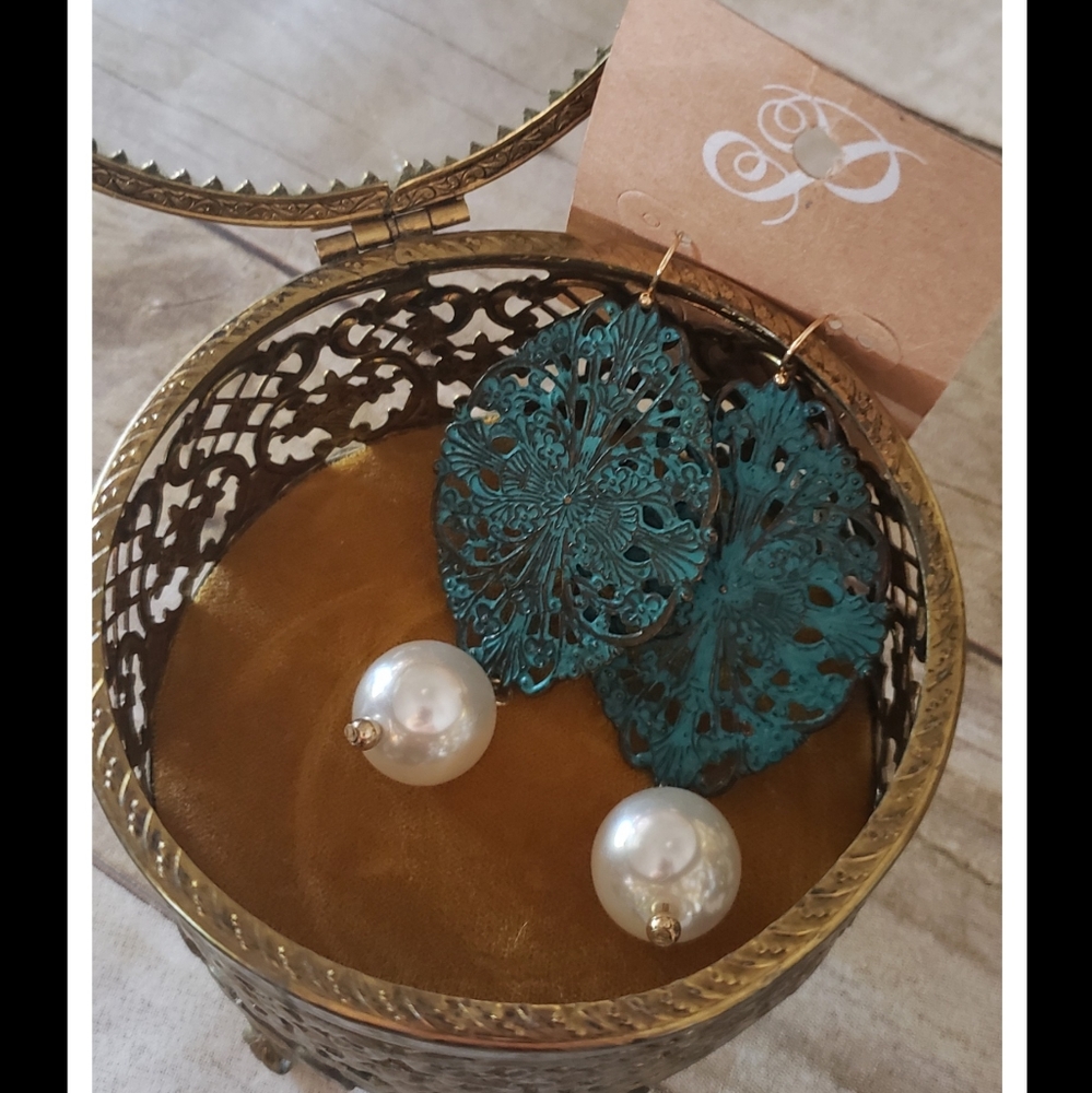 Turquoise metal with pearl earrings.